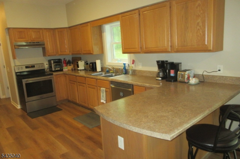 28 Beaver Run Road Lafayette, NJ 07848 - Photo 29 of 36 a kitchen with a sink a stove and cabinets