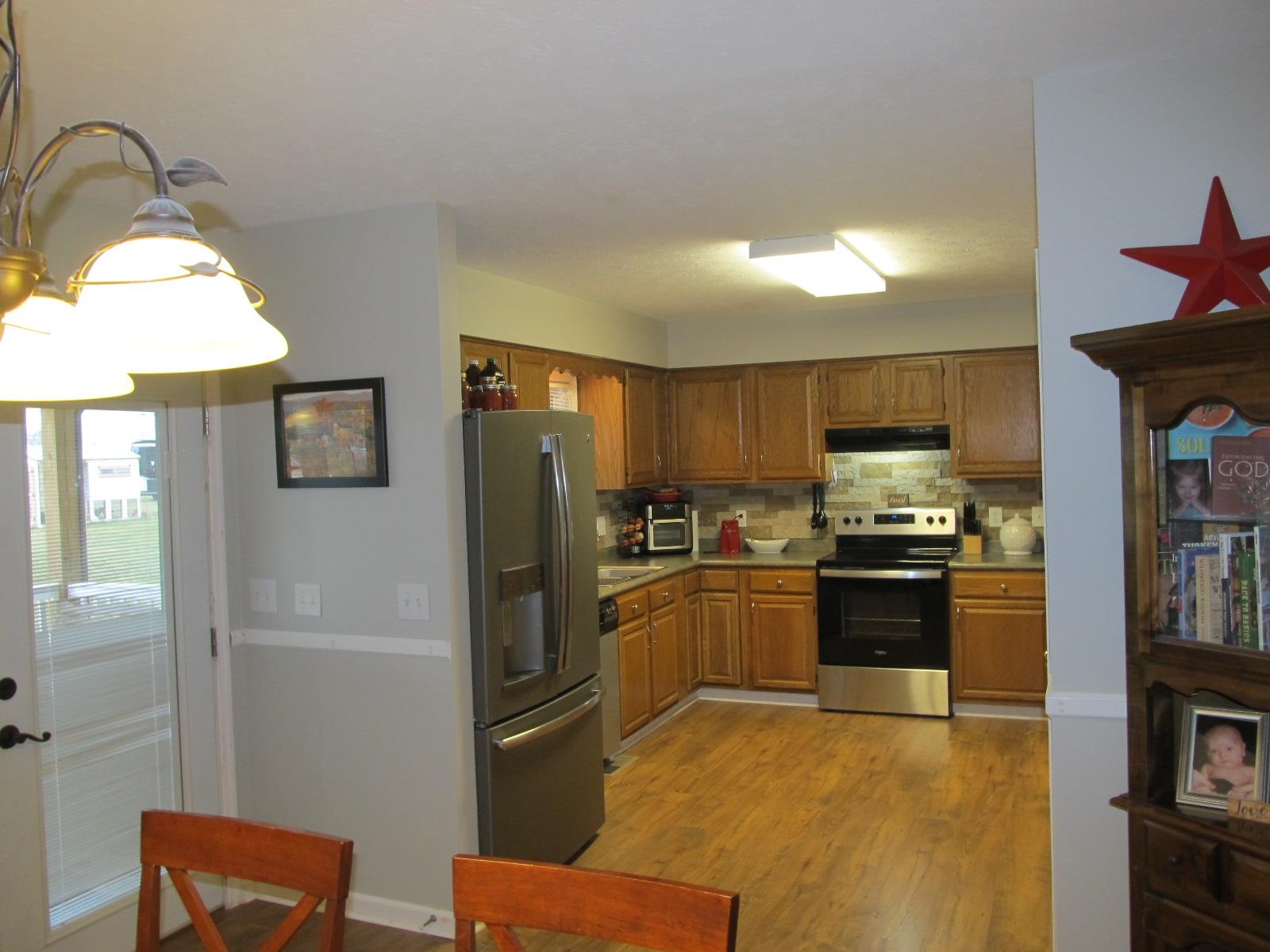 2118 Knightly Mill Road Fort Defiance, VA 24437 - Photo 17 of 49 a kitchen with stainless steel appliances granite countertop a refrigerator a stove and a sink
