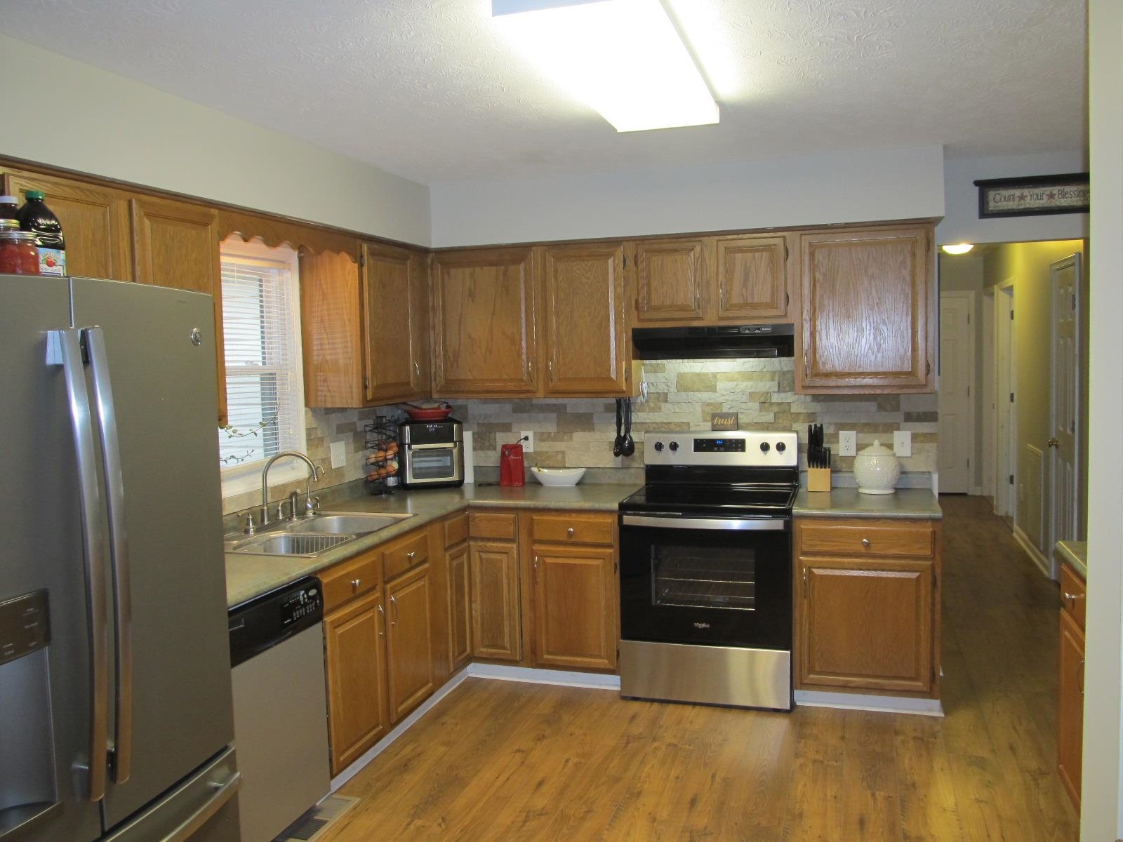 2118 Knightly Mill Road Fort Defiance, VA 24437 - Photo 18 of 49 a kitchen with stainless steel appliances granite countertop a refrigerator stove and sink