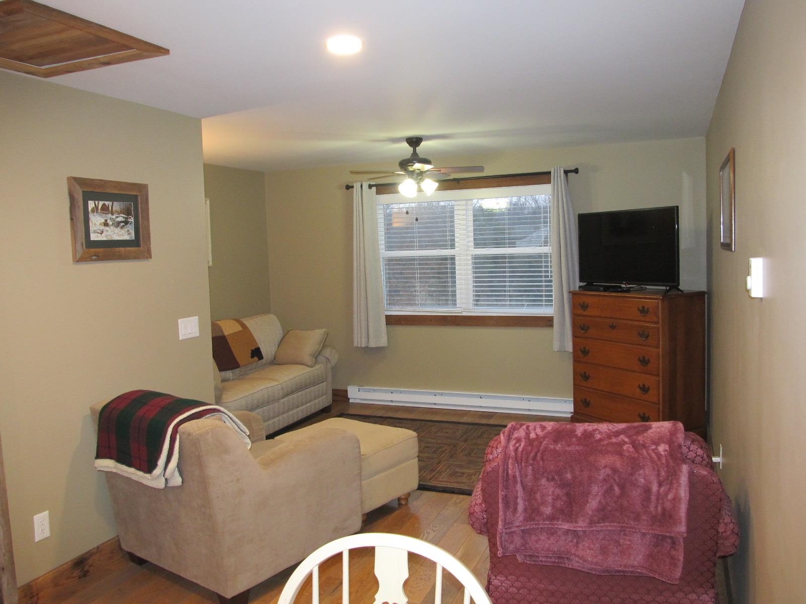 2118 Knightly Mill Road Fort Defiance, VA 24437 - Photo 38 of 49 a living room with furniture and a flat screen tv