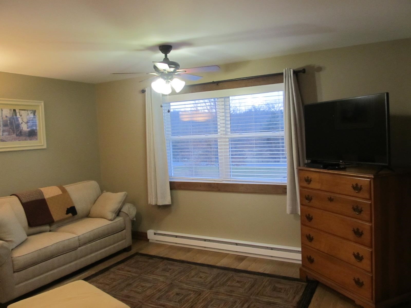 2118 Knightly Mill Road Fort Defiance, VA 24437 - Photo 39 of 49 a living room with furniture and a flat screen tv