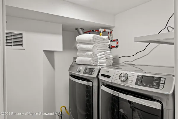 a utility room with dryer and washer