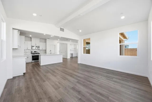 a view of kitchen view wooden floor and window