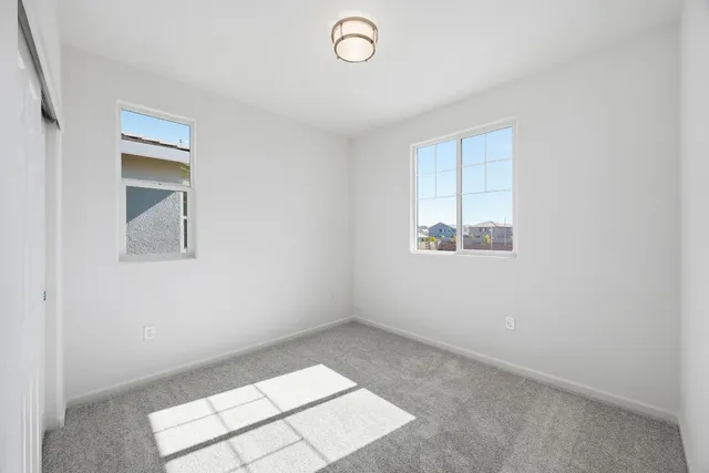 an empty room with windows