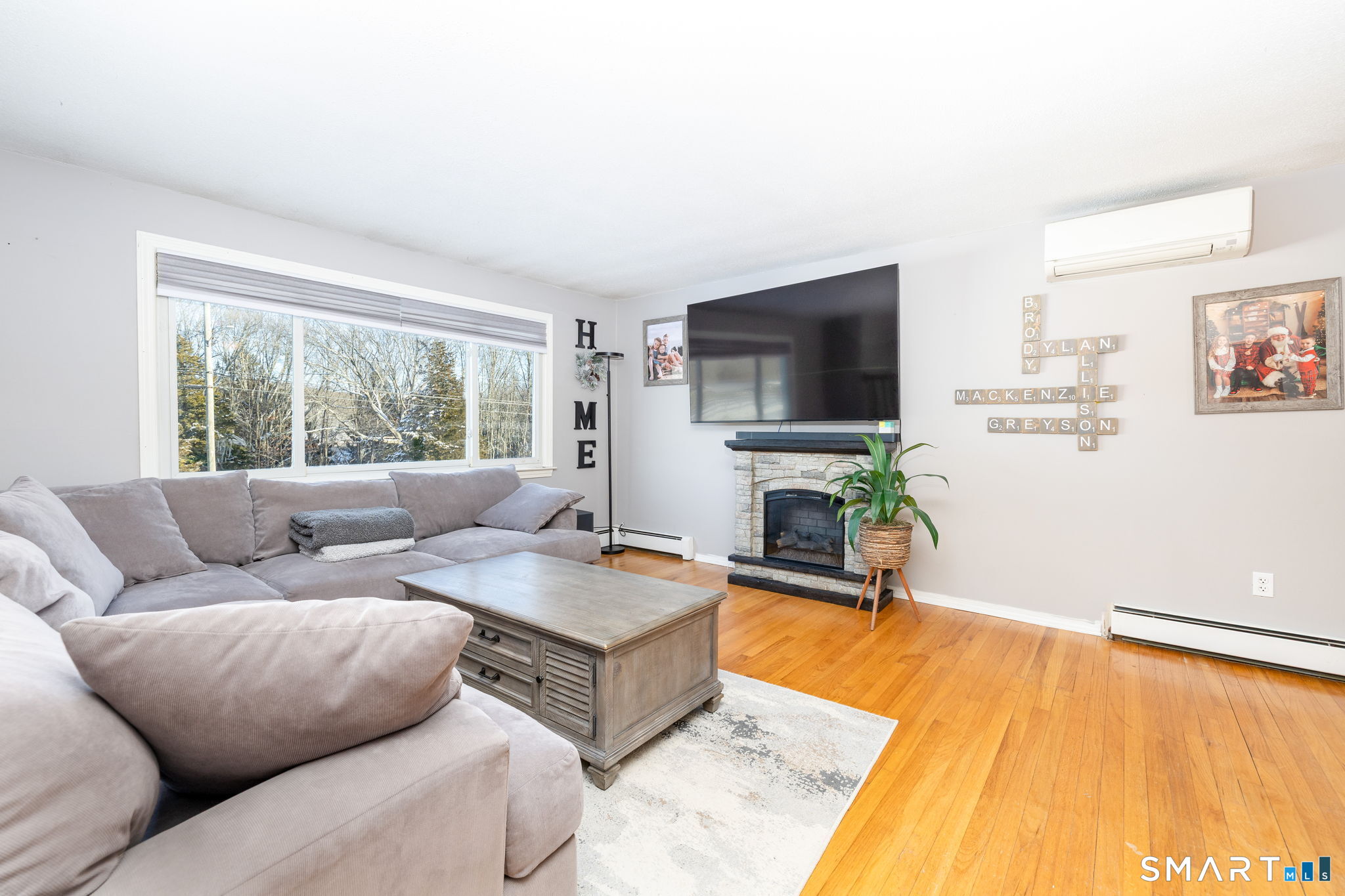 134 Massapeag Side Road Montville, CT 06382 - Photo 12 of 33 a living room with furniture and a flat screen tv