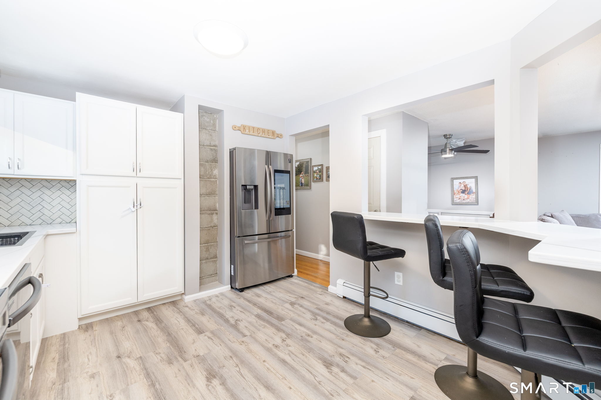 134 Massapeag Side Road Montville, CT 06382 - Photo 14 of 33 a view of a kitchen with refrigerator and dining table