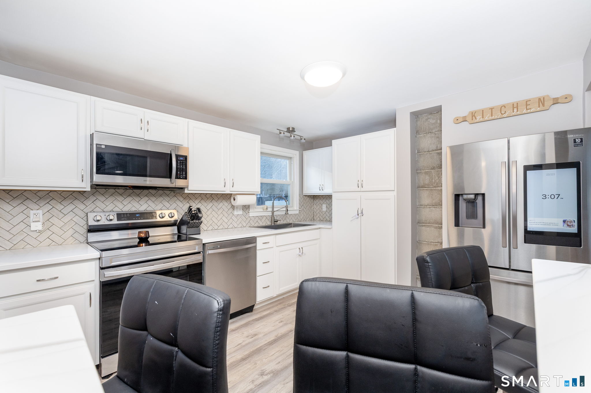 134 Massapeag Side Road Montville, CT 06382 - Photo 16 of 33 a kitchen with stainless steel appliances granite countertop a refrigerator stove microwave and sink