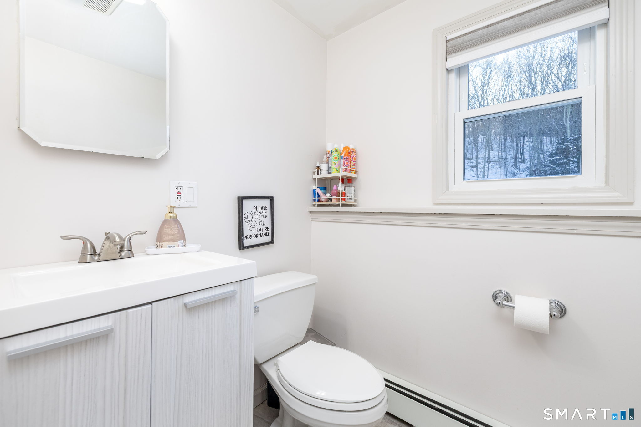 134 Massapeag Side Road Montville, CT 06382 - Photo 17 of 33 a bathroom with a toilet a sink a vanity and mirror