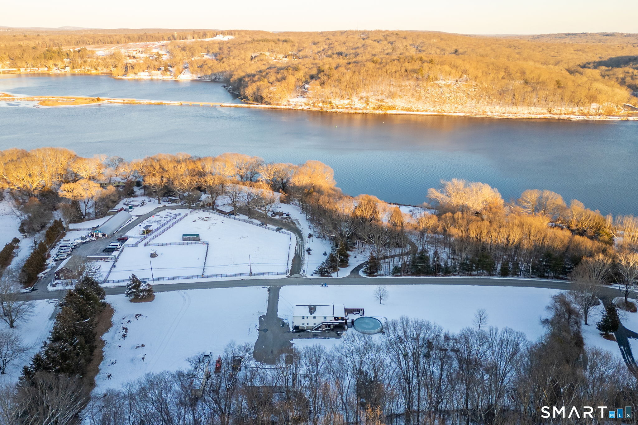 134 Massapeag Side Road Montville, CT 06382 - Photo 30 of 33 a view of a lake in middle of a house with a lake
