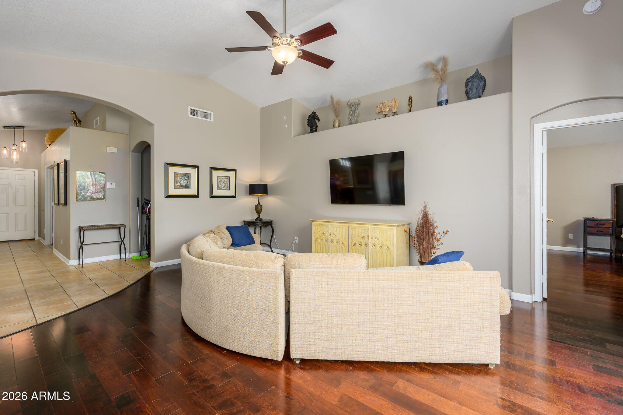 3136 East Roveen Avenue Phoenix, AZ 85032 - Photo 15 of 38 a living room with furniture and a flat screen tv