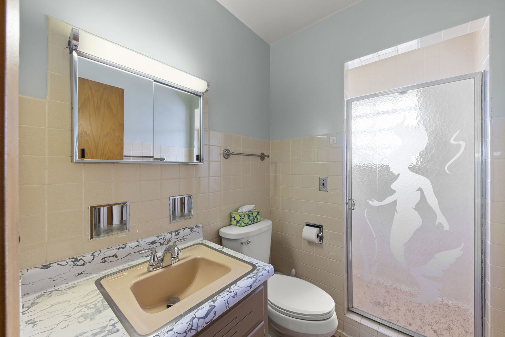 6401 West 52nd Street, Unit 2 Chicago, IL 60638 - Photo 12 of 18 a bathroom with a sink a toilet a mirror and shower