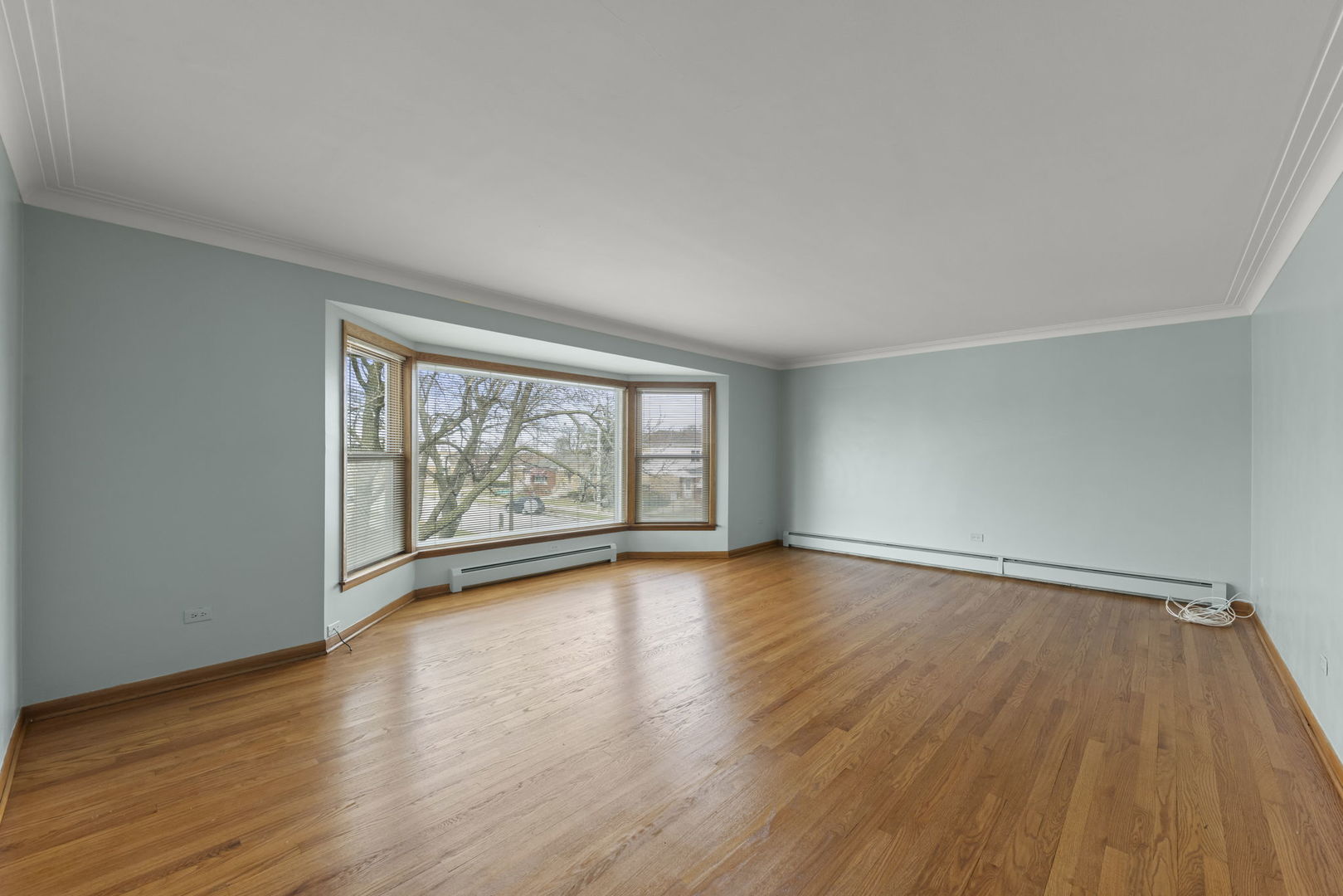 6401 West 52nd Street, Unit 2 Chicago, IL 60638 - Photo 15 of 18 wooden floor in an empty room with a window