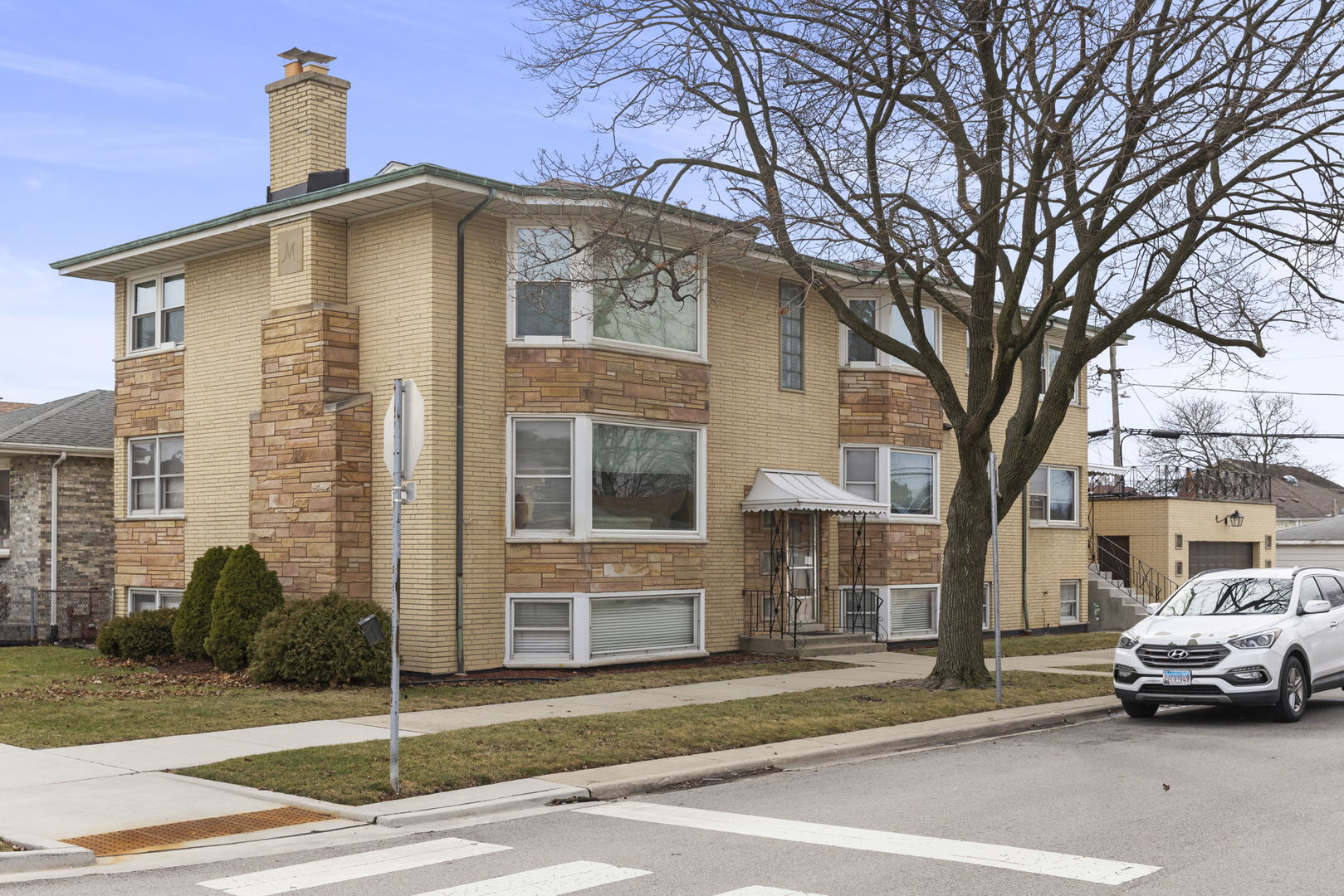 6401 West 52nd Street, Unit 2 Chicago, IL 60638 - Photo 16 of 18 a car parked in front of a building