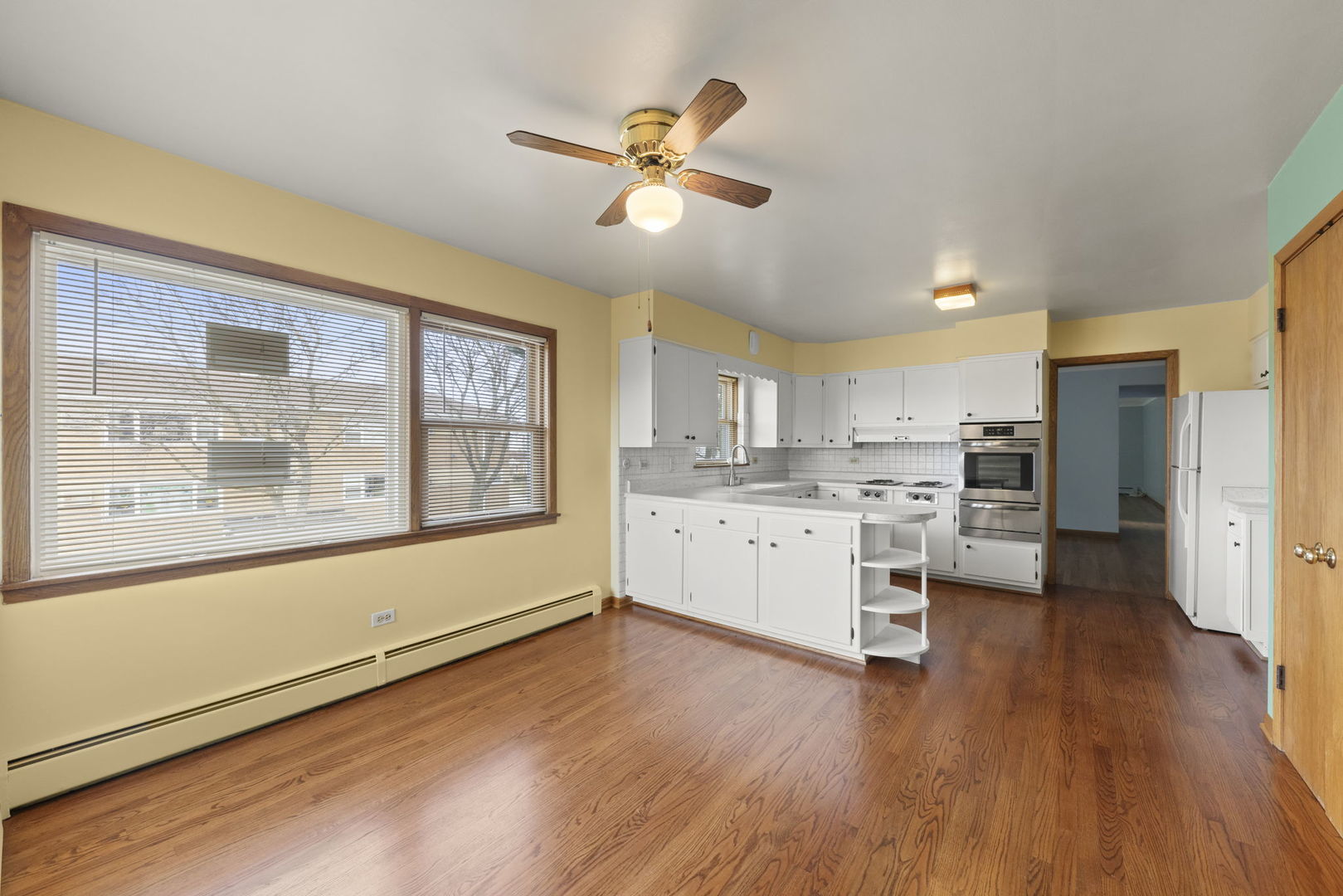 6401 West 52nd Street, Unit 2 Chicago, IL 60638 - Photo 4 of 18 a kitchen with a refrigerator and a stove top oven