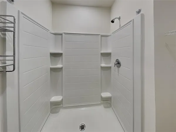 a bathroom with a shower and a toilet