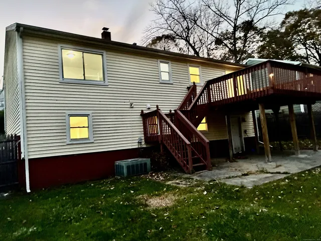 a kitchen with stainless steel appliances granite countertop a refrigerator a oven a sink and a refrigerator