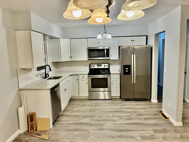 a view of a kitchen with a sink