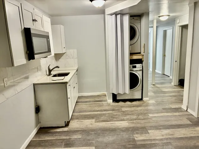 view of a bathroom with a sink and mirror