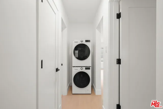 a close view of a utility room with dryer and washer