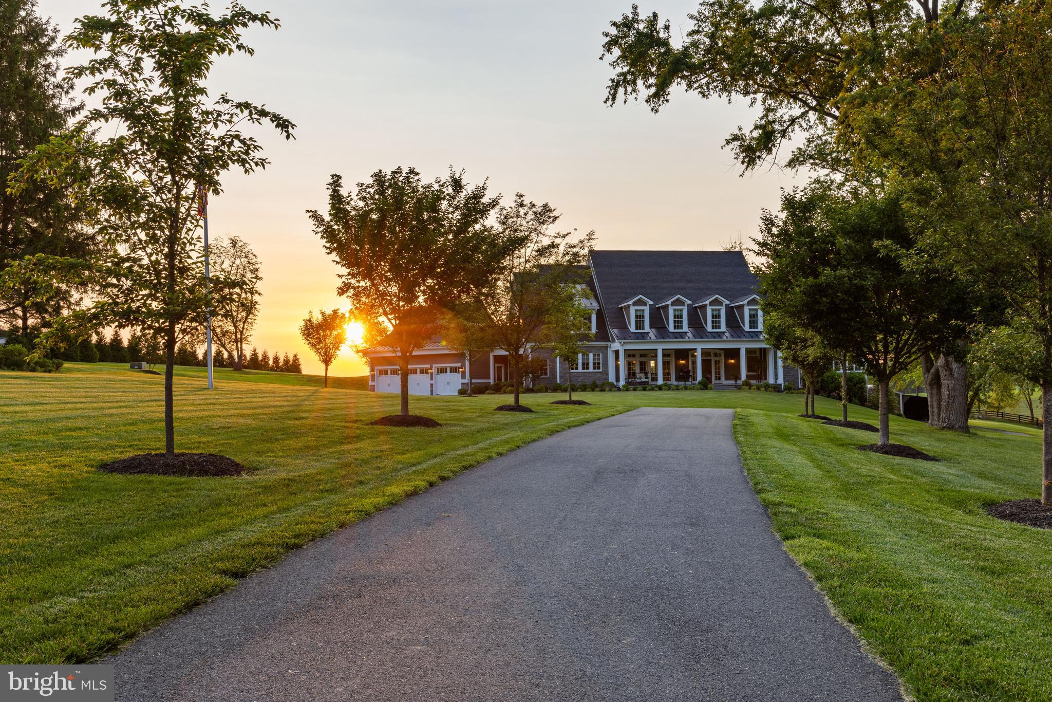 a view of a park with a house in the background