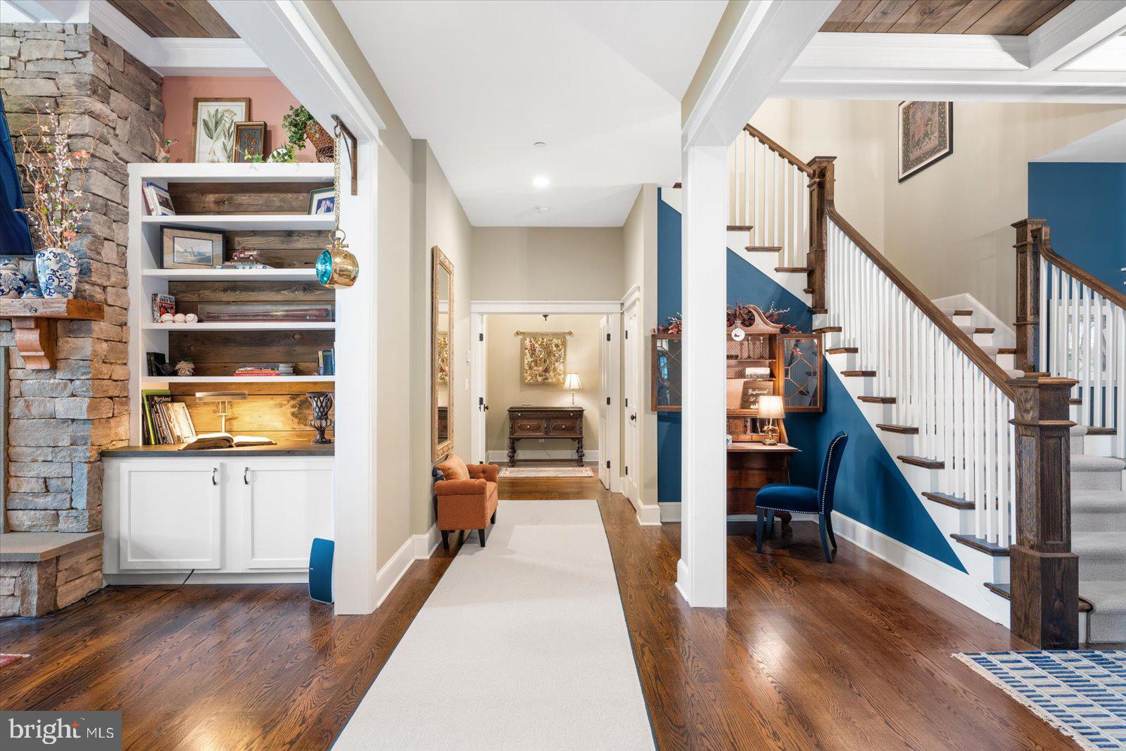 828 Federal Hill Road Street, MD 21154 - Photo 14 of 73 a view of a hallway with wooden floor and staircase