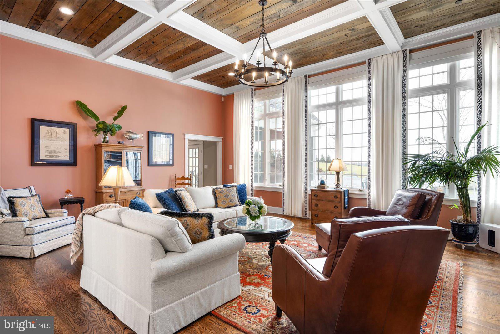 828 Federal Hill Road Street, MD 21154 - Photo 22 of 73 a living room with furniture a chandelier and a large window