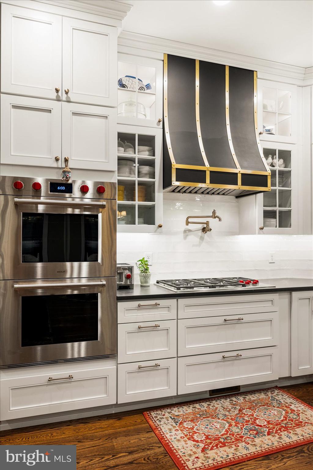 828 Federal Hill Road Street, MD 21154 - Photo 25 of 73 a kitchen with stainless steel appliances kitchen island granite countertop a stove a microwave and a sink