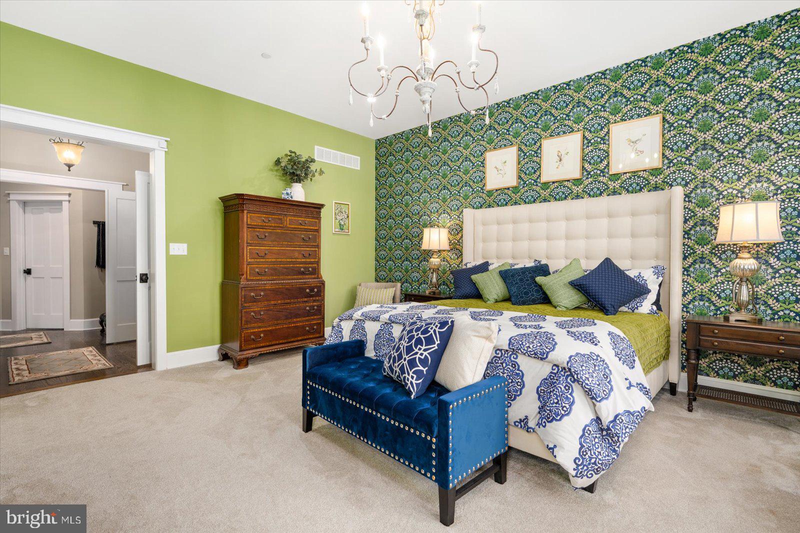 828 Federal Hill Road Street, MD 21154 - Photo 35 of 73 a bedroom with a bed and a chandelier