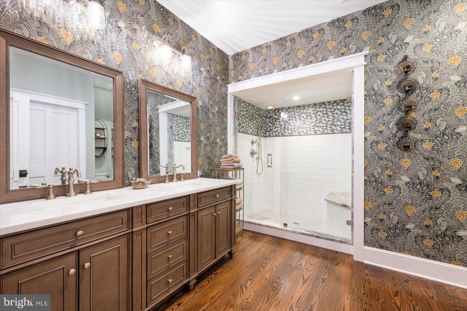 828 Federal Hill Road Street, MD 21154 - Photo 45 of 73 a spacious bathroom with a double vanity sink a mirror and a shower