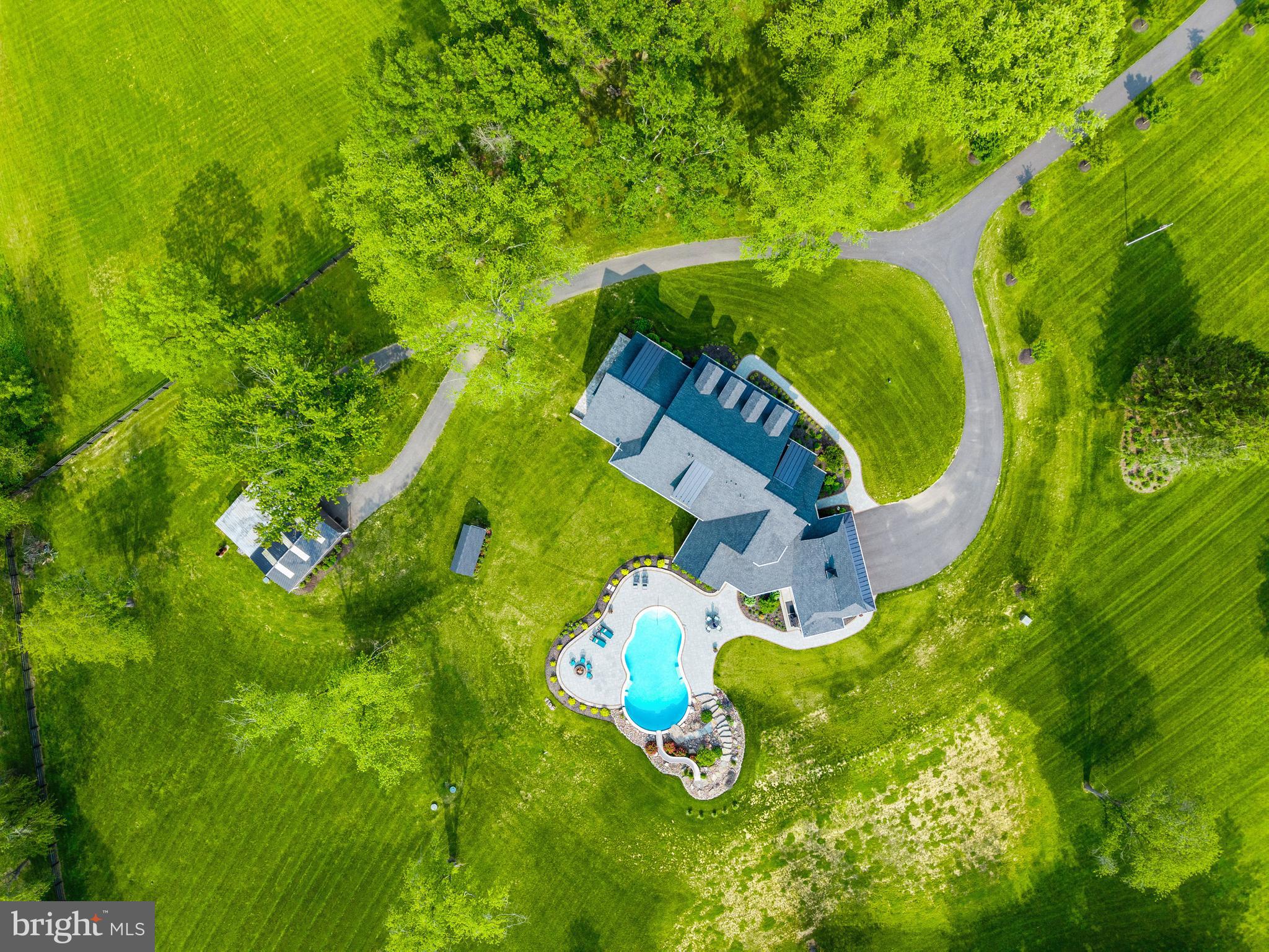 828 Federal Hill Road Street, MD 21154 - Photo 73 of 73 an aerial view of a house with a swimming pool and green space