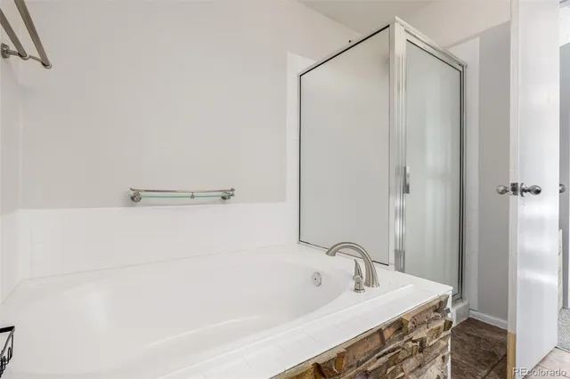 a bathroom with a bathtub and a sink