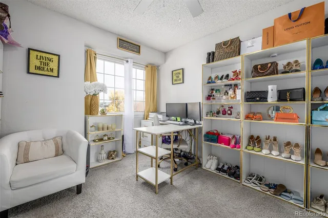 a bathroom with a granite countertop sink toilet a large mirror and shower