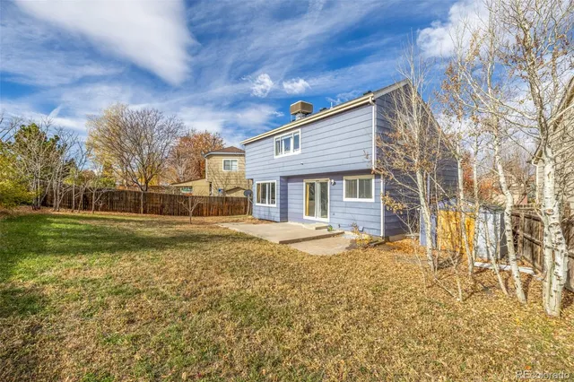 a view of a backyard of the house