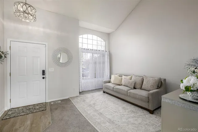 a living room with furniture and window