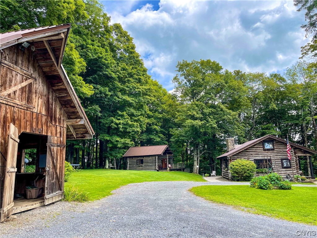 7807 Bonney Hill Road Hamilton, NY 13346 - Photo 1 of 50 View of the barn, guest cottage, and main cabin lo