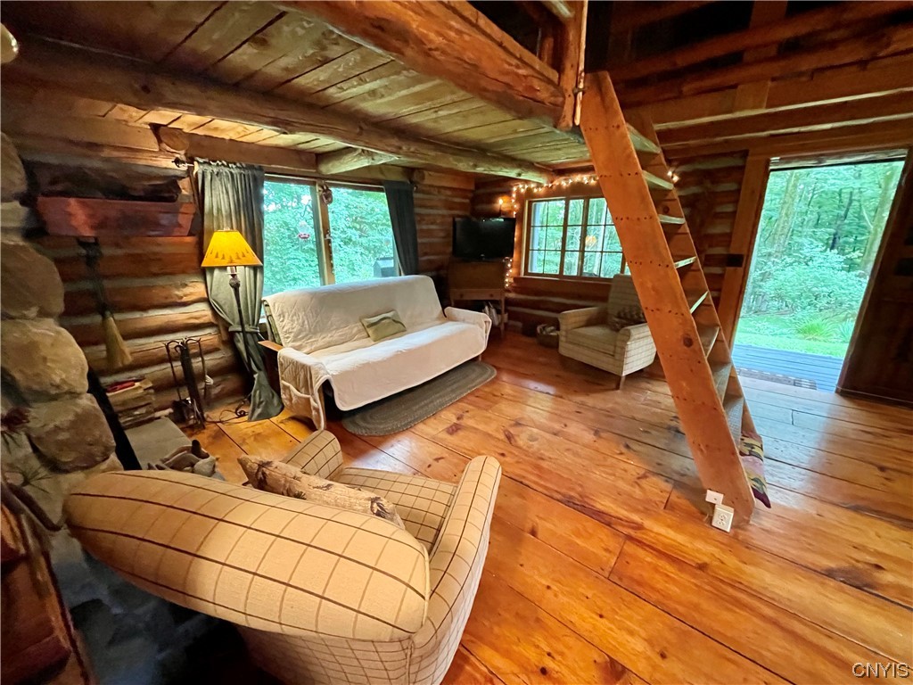 7807 Bonney Hill Road Hamilton, NY 13346 - Photo 14 of 50 Main living area in cabin. Ladder is access to lof