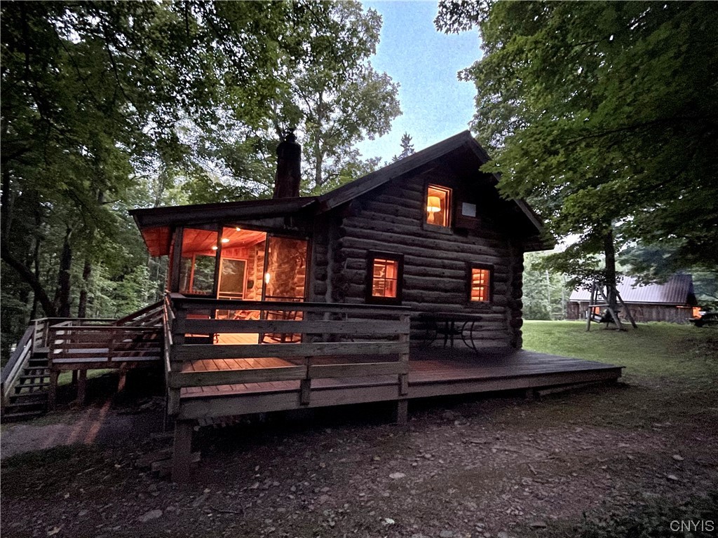 7807 Bonney Hill Road Hamilton, NY 13346 - Photo 26 of 50 Side of guest cottage at dusck