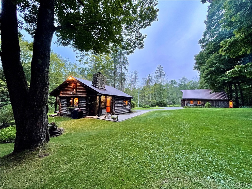 7807 Bonney Hill Road Hamilton, NY 13346 - Photo 7 of 50 View of main cabin with barn on the right
