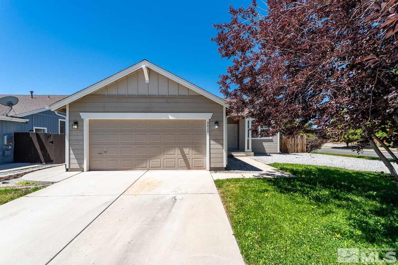 9025 Andraste Way Reno, NV 89506 - Photo 1 of 31 a front view of a house with a yard and garage