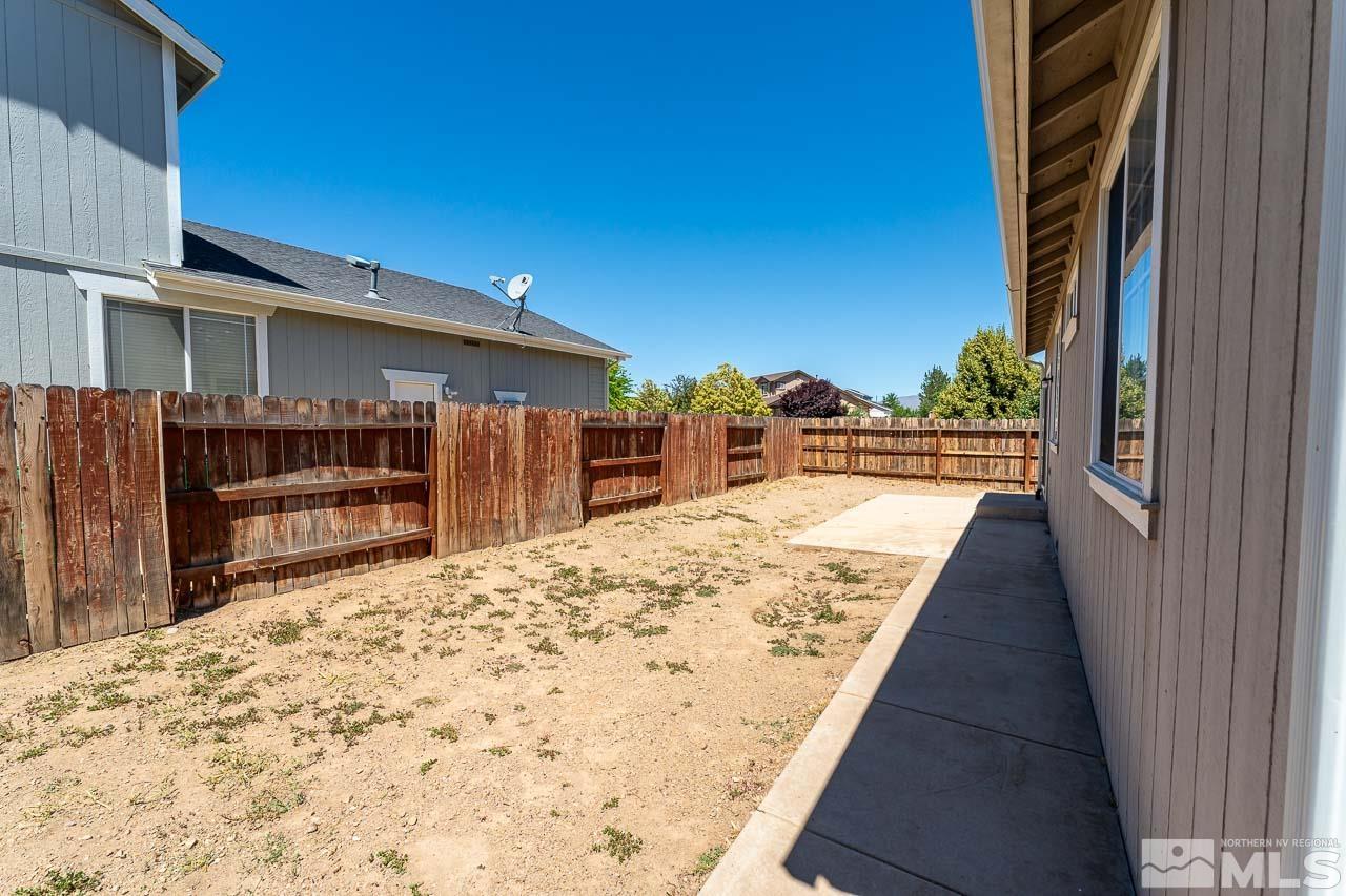 9025 Andraste Way Reno, NV 89506 - Photo 30 of 31 a view of a house with a wooden floor