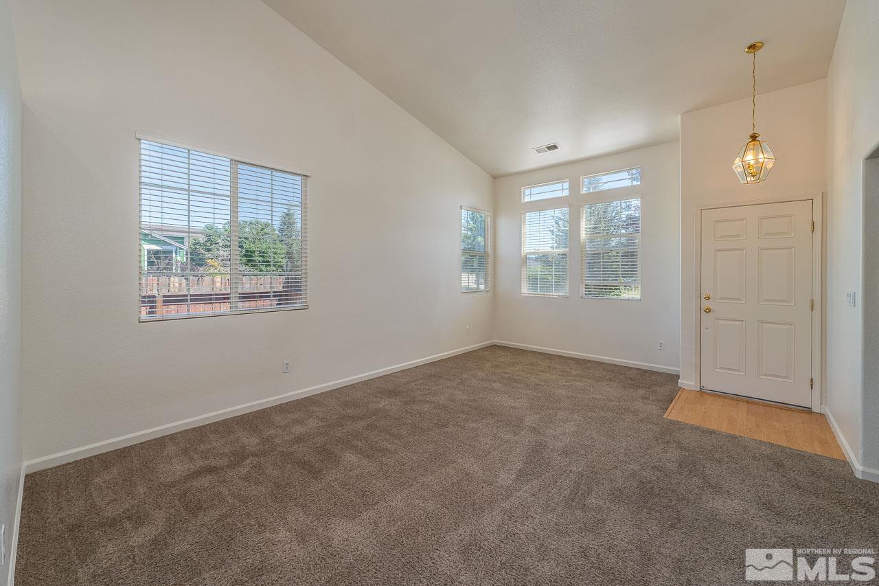 9025 Andraste Way Reno, NV 89506 - Photo 6 of 31 an empty room with windows and closet