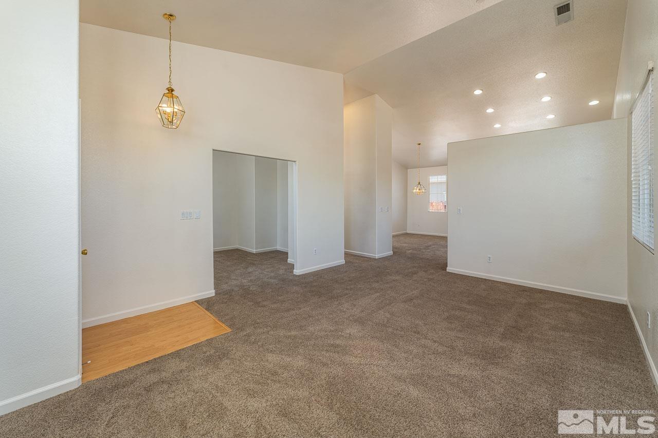 9025 Andraste Way Reno, NV 89506 - Photo 8 of 31 a view of a livingroom with a kitchen