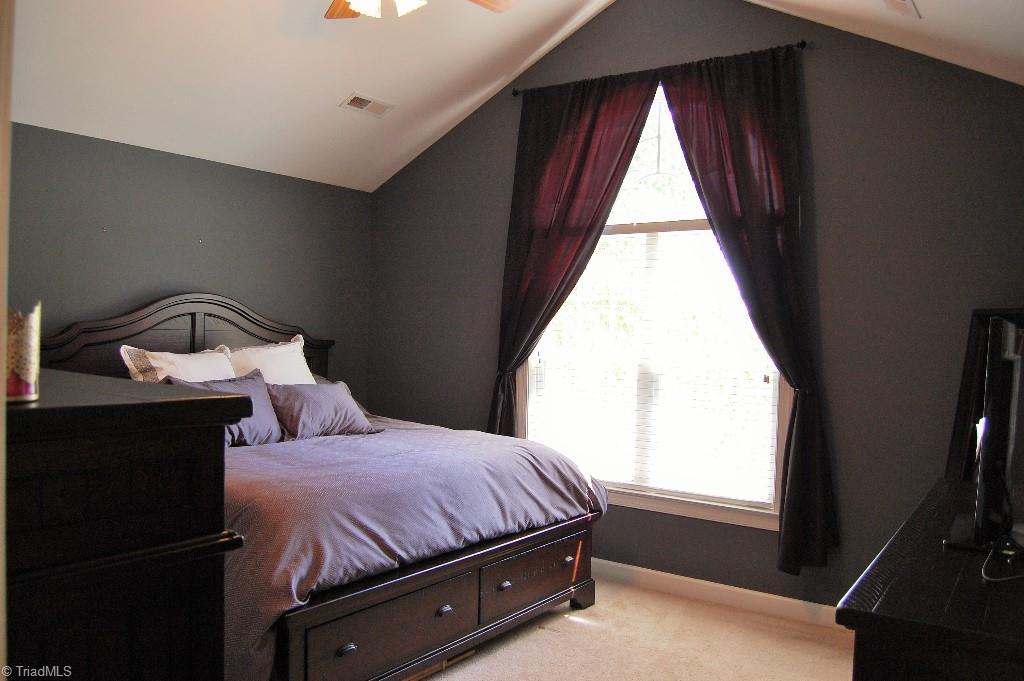 1883 South Union Grove Road Lexington, NC 27295 - Photo 15 of 30 Master suite features vaulted ceilings and palladium window. Plenty of space after fitting with king size bed and large dressers.