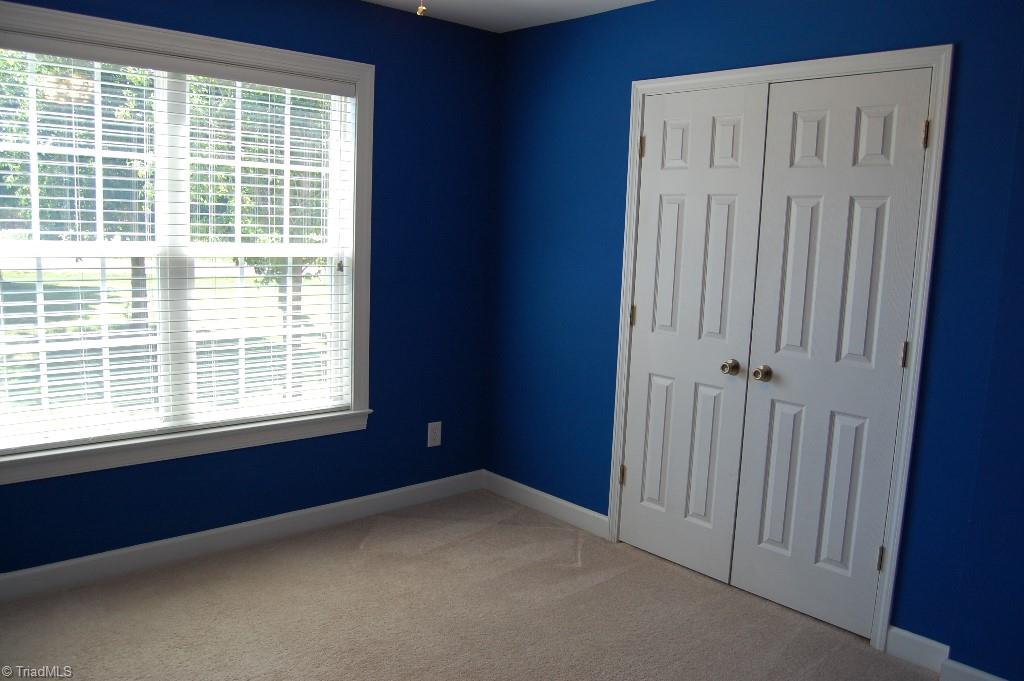 1883 South Union Grove Road Lexington, NC 27295 - Photo 20 of 30 Who gets this room? Bedroom 3 has double window and double closet doors for plenty of storage.