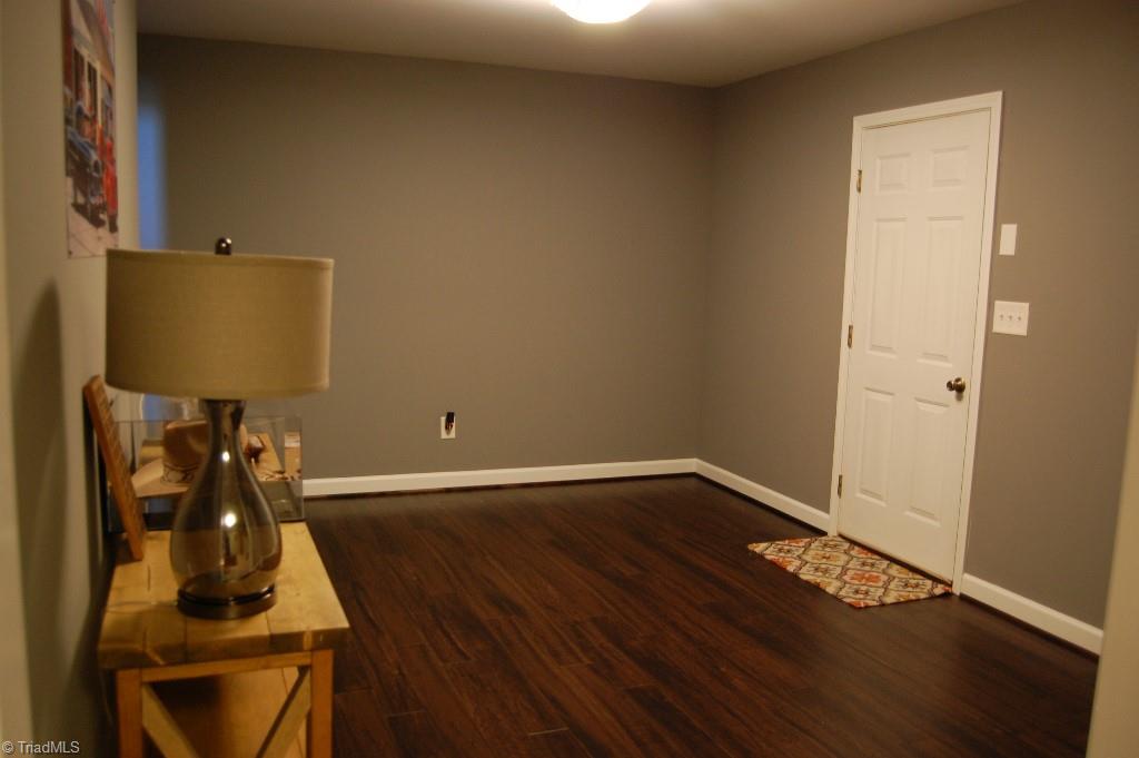 1883 South Union Grove Road Lexington, NC 27295 - Photo 22 of 30 The first finished space of the basement. Features exceptional Connecto flooring. Separate entry from garage area. Use as a rec room, office, exercise, or convert to a kitchen to complete a guest suite.