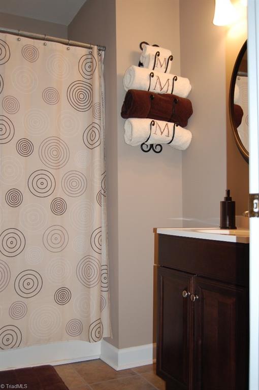1883 South Union Grove Road Lexington, NC 27295 - Photo 25 of 30 Full bath in finished lower level make this an easy space for guests, teens or college visitors. Stylish dcor and neutral colors continue in this space. Bath also features the Connecto flooring.