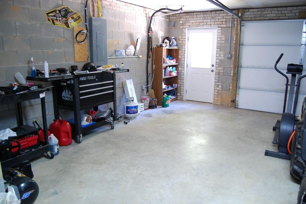 1883 South Union Grove Road Lexington, NC 27295 - Photo 26 of 30 Double garage has ample space for vehicles, motorized toys and workbench areas or more storage.