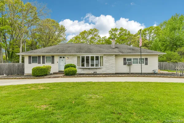front view of a house with a patio
