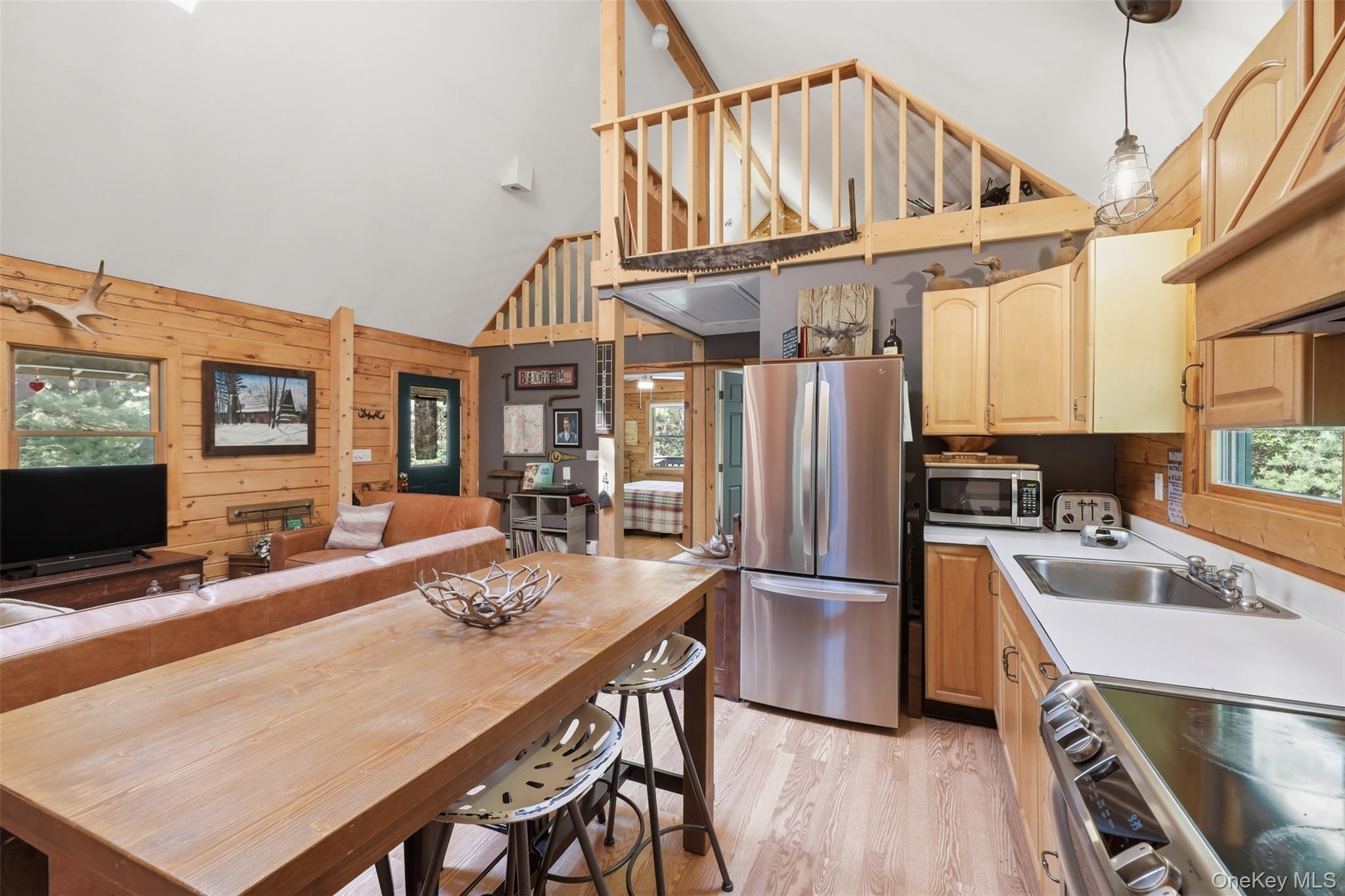 301 Pucky Huddle Road Bethel, NY 12720 - Photo 13 of 39 Stainless steel appliances, light wood cabinets, eat in kitchen setup