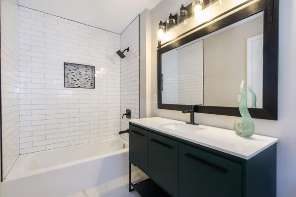 a bathroom with a sink and a bathtub